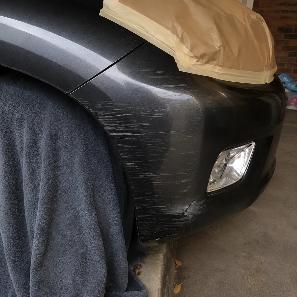 Body kit repair: bumper scuff before Mark's repair